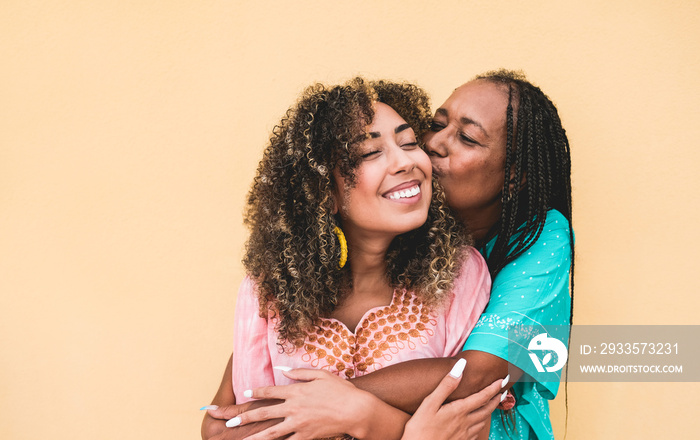 African mother hug and kiss adult daughter - Family, mother and child love