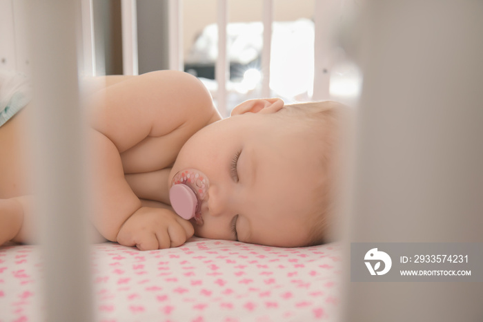 Cute little baby sleeping in crib