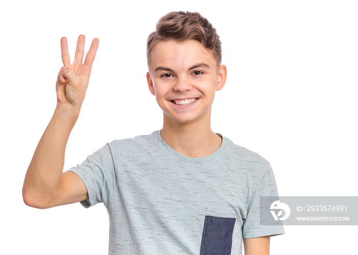 Portrait of happy teen boy showing one palm - 3 fingers, isolated on white background. Happy smiling child doing gesture of number Three. Series of photos count from 1 to 10.