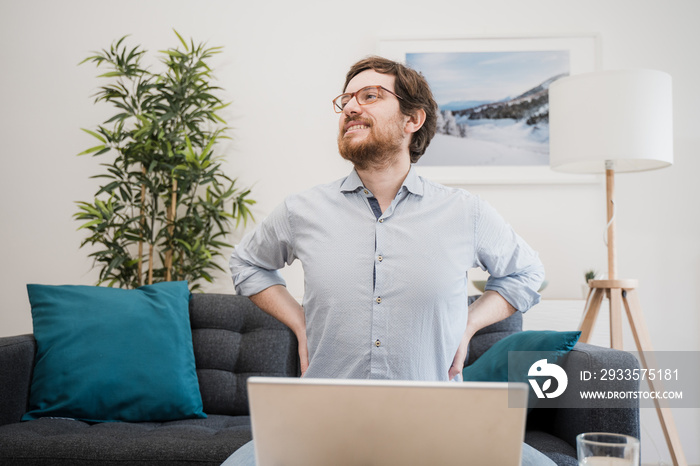 Painful guy aching from pain in back or reins at home