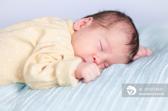 Portrait of a newborn sleeping baby . High quality photo