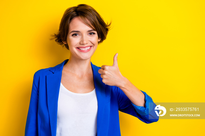 Photo of positive young attractive pretty entrepreneur woman thumb up like recommend her law agency banner isolated on yellow color background