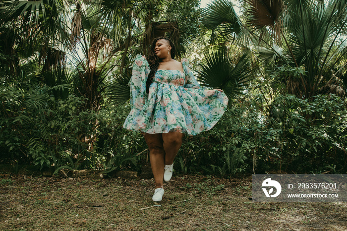 plus size woman holds skirt and smiles