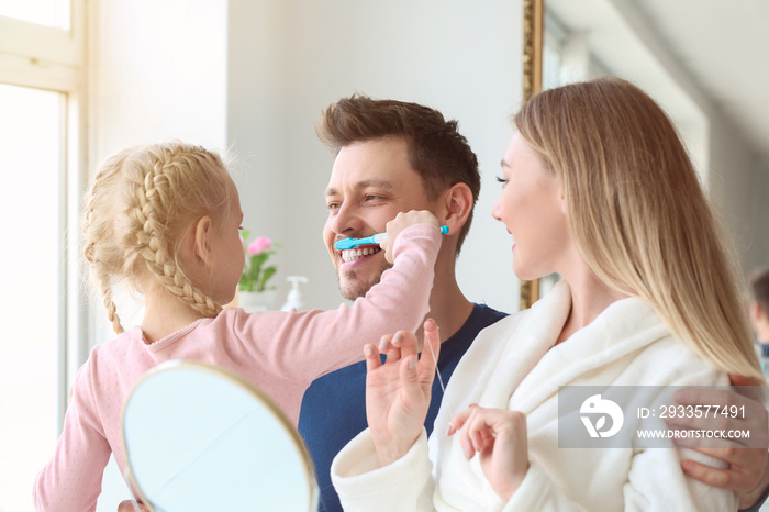 Family cleaning teeth at home