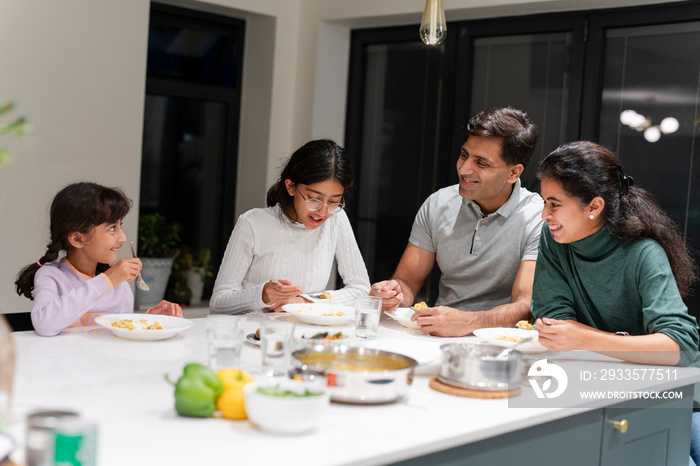 Family dining at home in evening