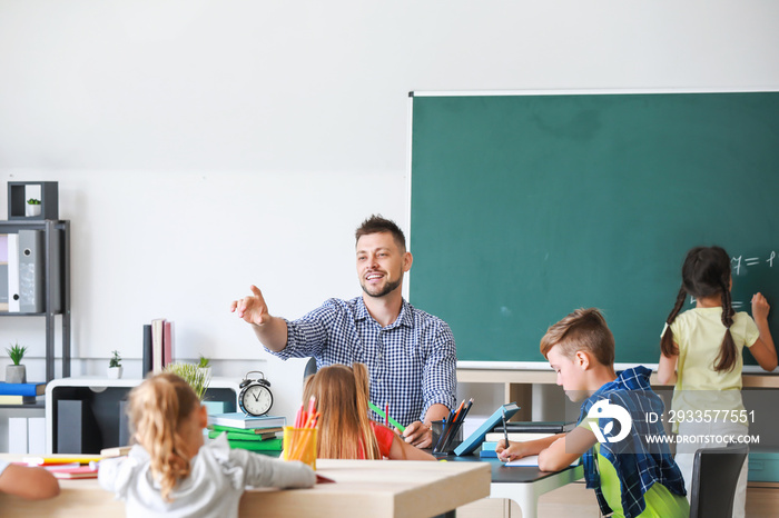 Teacher conducting lesson in classroom