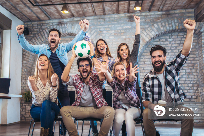 Happy friends or football fans watching soccer on tv and celebrating victory. Friendship, sports and entertainment concept.