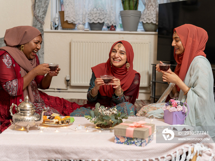 Women having tea during Ramadan celebration at home