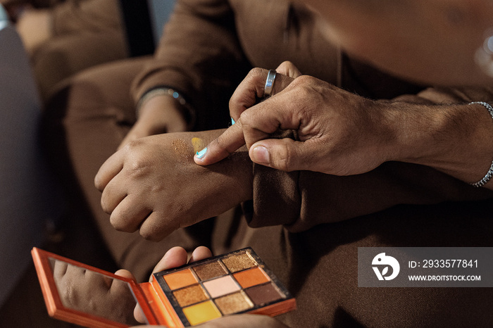 Group of friends doing each others make up at home during a sleepover