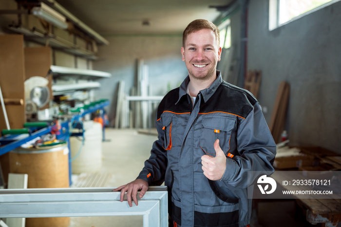 Worker in workshop for manufacture of windows and doors