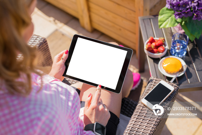 Woman using tablet computer, horizontal screen mockup