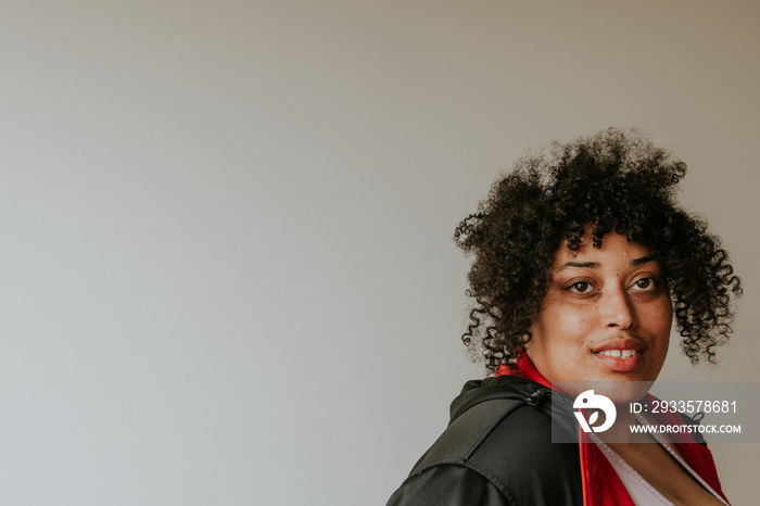 closeup portrait of a plus size afro indigenous person looking at camera