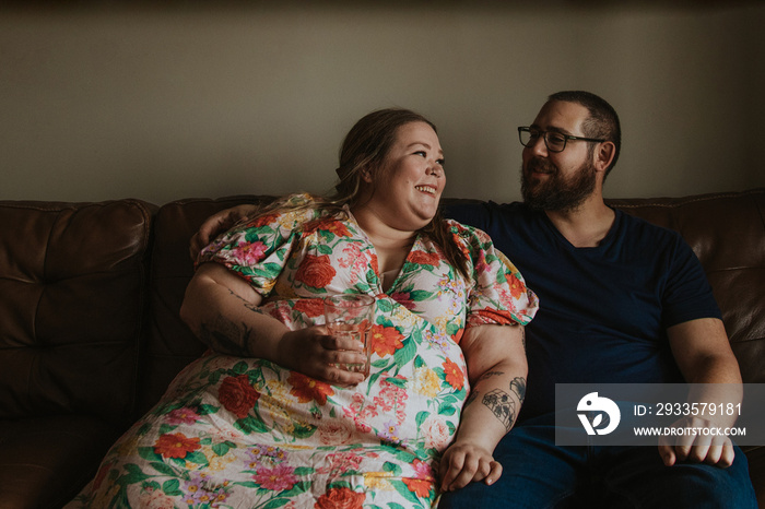 couple sitting and smiling at each other