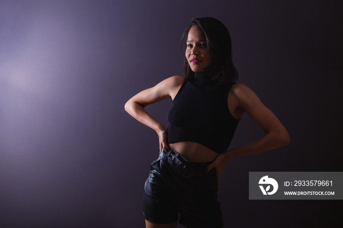 young adult woman from northeastern brazil. female portrait, against light, underexposed photo. low light.