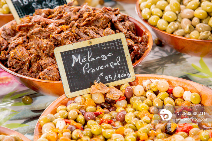 Provencal Mix of Olives ( Melange Provencal  in French) ) in wooden bowl at the food market in Paris