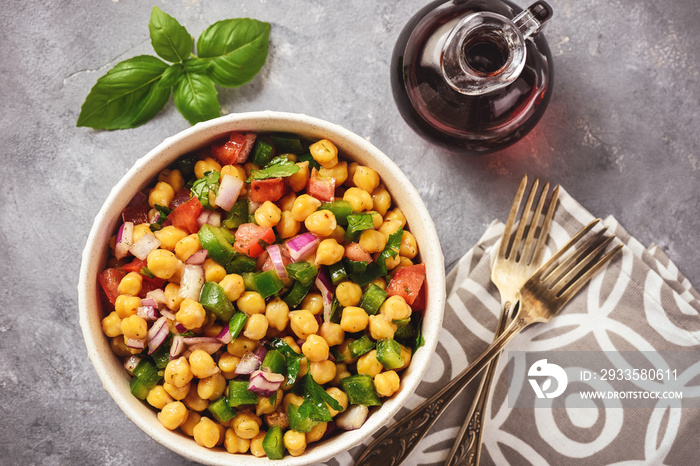 Chickpea salad with green pepper, red onion and vinaigrette dressing.