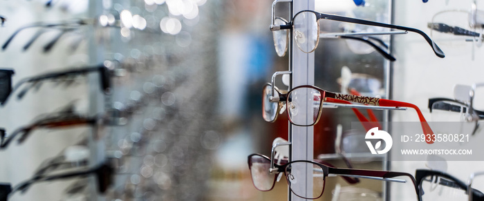 Eye glasses in a store. Eyeglasses shop. Stand with glasses in the store of optics.