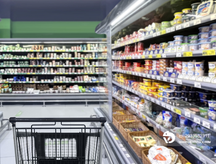 empty grocery cart in an empty supermarket