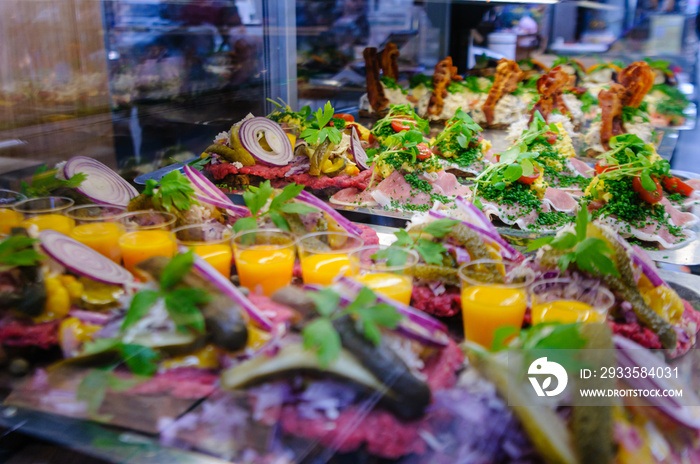 Danish Smørrebrød, traditional open sandwiches made with rye bread, on sale in a food market in Copenhagen.