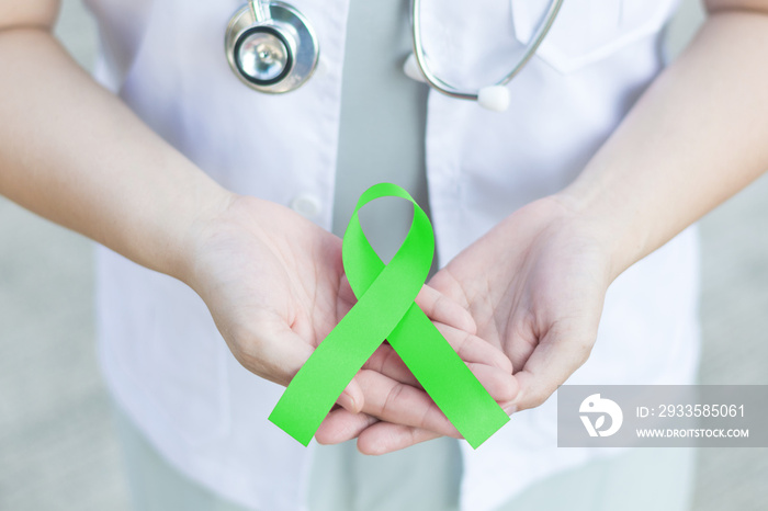 Doctor with lime green ribbon awareness for Lyme Disease,Lymphoma,Muscular Dystrophy, National Wise Mental Health Consumer Month