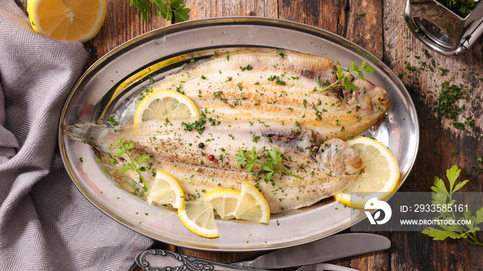 fish fillet cooked with oil, butter, herbs and lemon