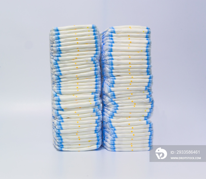 Two stacks of diapers on white background.