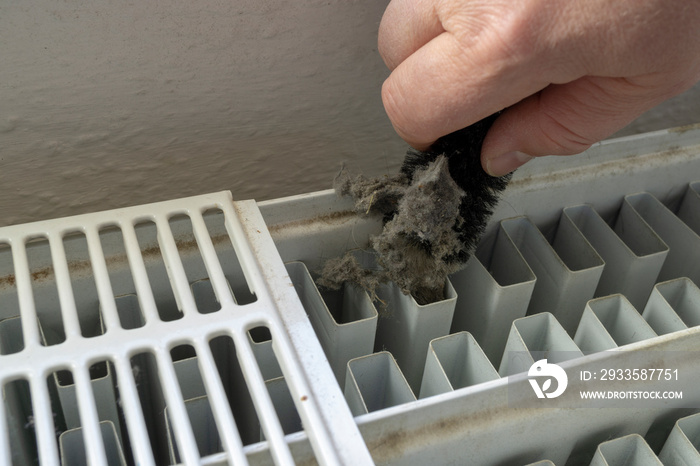 Cleaning a radiator with a brush