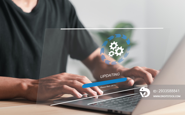 Businessman working and Installing update process. Software update or operating system upgrade to keep the device up to date with added functionality in new version and improve security.