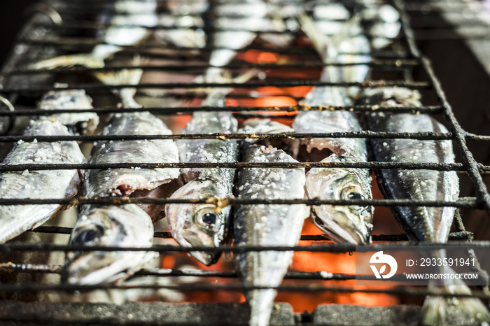 Small fish barbequed on charcoal