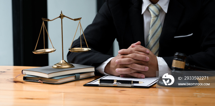 Attorneys or judges sitting at work to sign important documents, attorneys and law, legal concepts of the judiciary and the legislature.