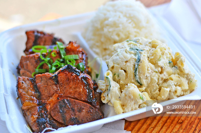 Korean style kalbi beef short ribs with white rice and macaroni salad Hawaiian style plate lunch on Oahu in Hawaii