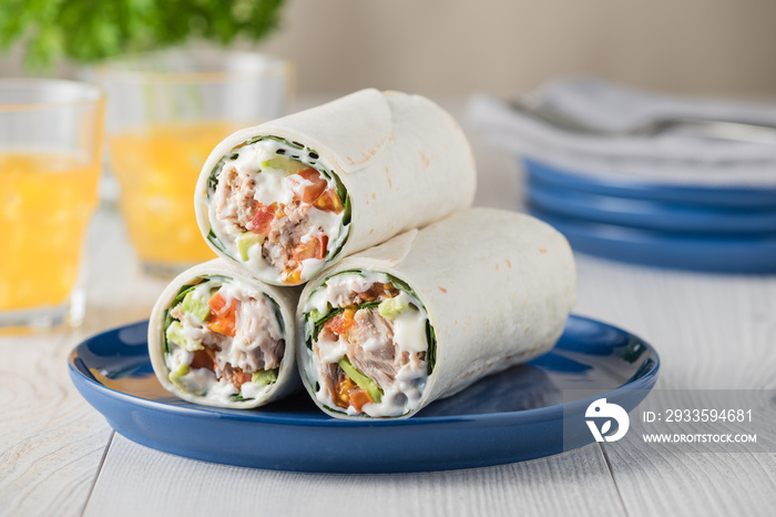 Tuna wraps with avocado tomato and mayonnaise