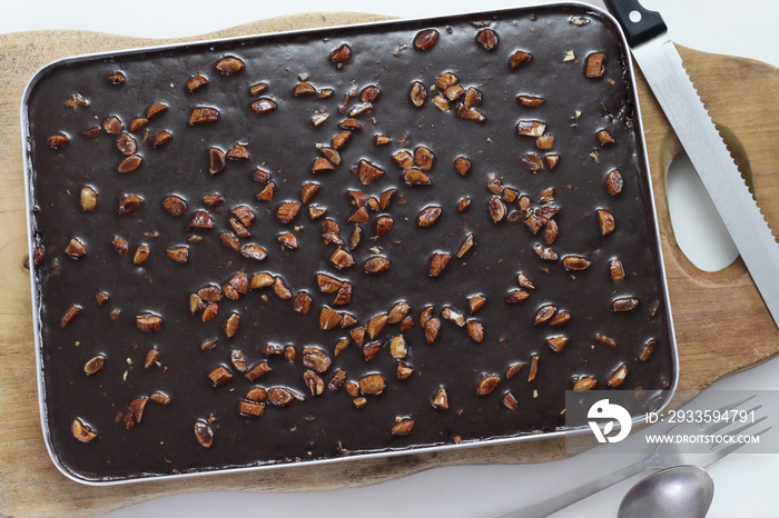 Texas sheet cake. Buttery and chocolaty cake inside the baking bin. Fresh from Oven