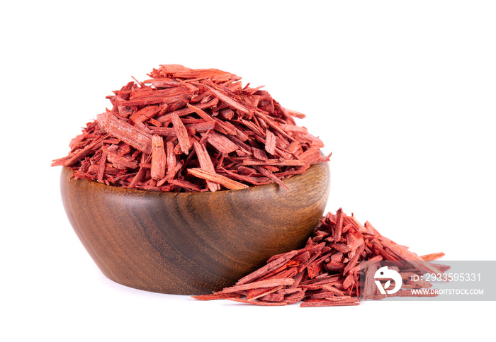 Red Sandalwood incense chips in wooden bowl, isolated on white background. Sanderswood, rubywood or red saunders.