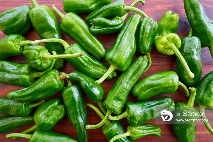 Padron peppers green on a wooden table