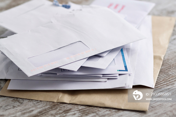 A stack of professional or invoice letters