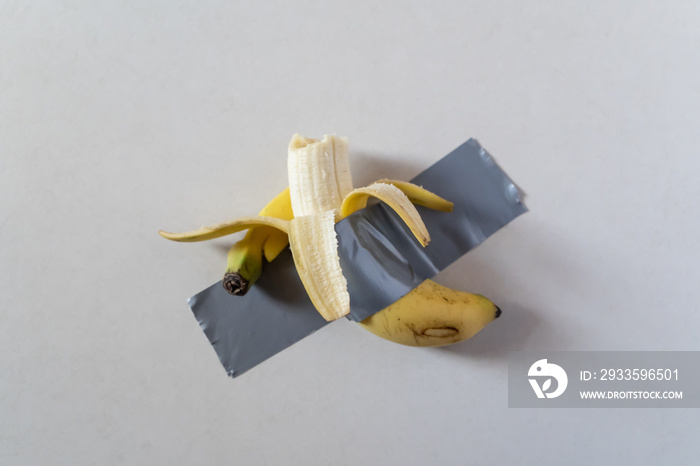 Bitten banana duct taped to wall