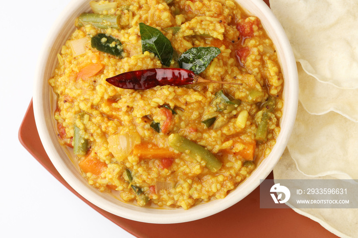 South Indian traditional vegetarian rice dish, bisi bele bath, Sambar rice with rice and pigeon pea as the main ingredients.