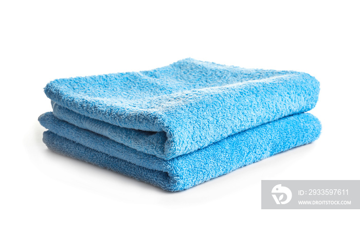 Folded clean terry towels on white background