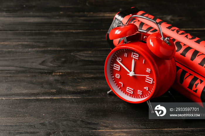 Bomb with clock timer on wooden background