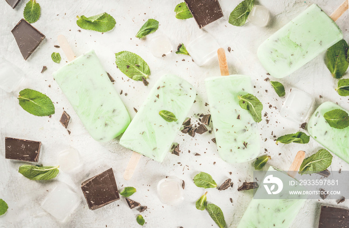 Homemade ice cream. Summer desserts. Refreshing popsicle with mint and chocolate. On a white stone table.