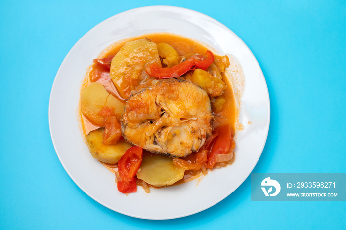 typical portuguese fish stew on white plate