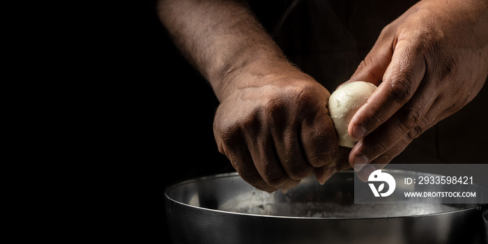 The processing Traditional Italian mozzarella, Cheesemaker, showing freshly made mozzarella. Long banner format