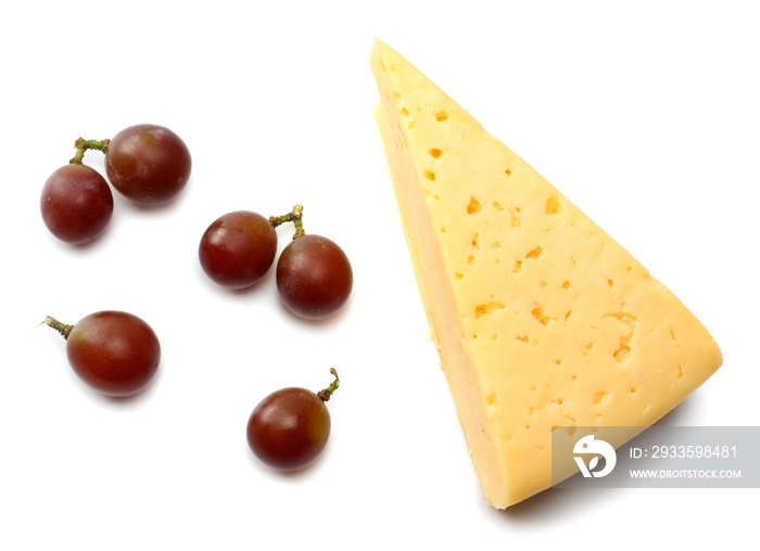 piece of cheese with grapes isolated on white background