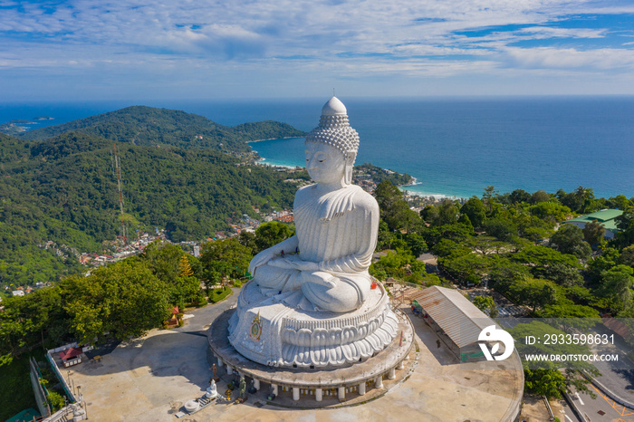 aerial photography Phuket big Buddha in sunny day.Phuket Big Buddha is one of the most important and revered landmarks on Phuket island..white cloud in blue sky, blue sea and mountain background