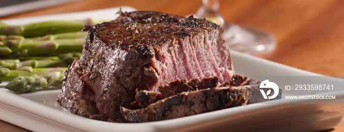 tenderloin steak cut open cooked rare in panoramic composition