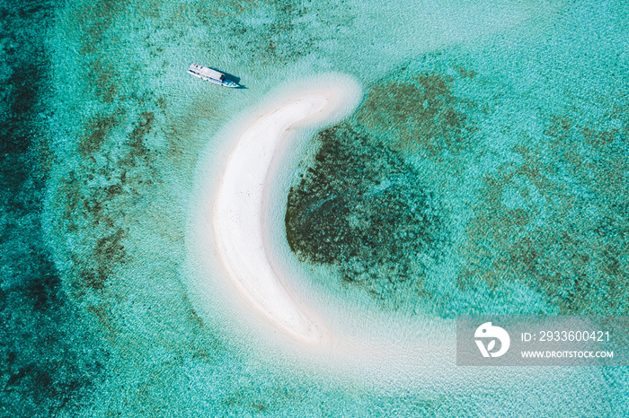 Aerial view of Taka Makassar island in Komodo national park, Indonesia. Empty paradise small white sand island