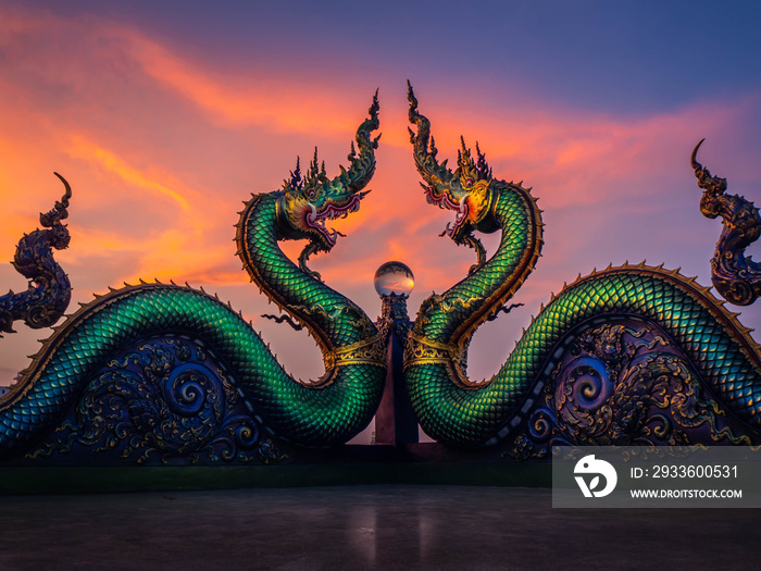 Naga or serpent statue with sunset  in Wat khao phra kru temple, Chonburi province thailand, The belief of Buddhism, Thai temple.