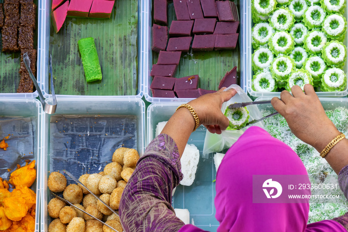 Top view of unidentified vendor at the food stall in Kota Kinabalu city food market, Sabah, Malaysia.