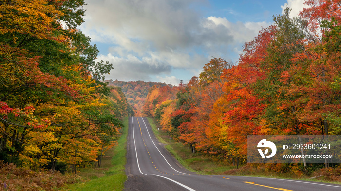 Autumn scenic drive through the tunnel of Trees in Michigan Upper Peninsula UP - Highway 41  M26